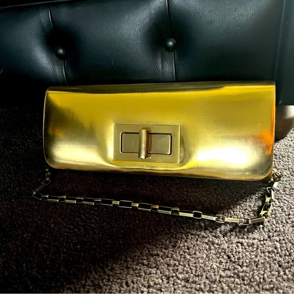 NWT - Olga berg gold clutch bag. NWT. Comes with chain strap. Rectangular clasp. - Picture 1 of 15